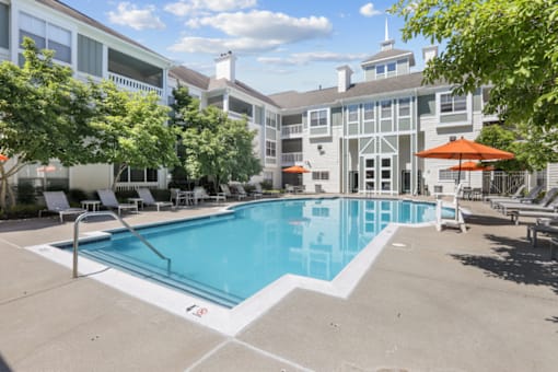 Resort-style pool with sun deck at The Crossings at Russett in Laurel, MD