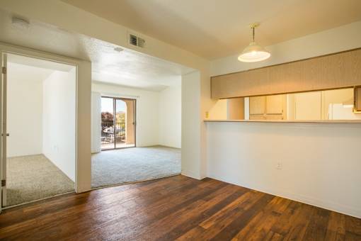 Open living area with rich wood vinyl plank flooring