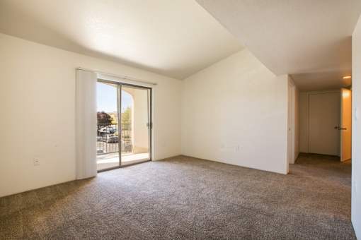 Large living room with private balcony access