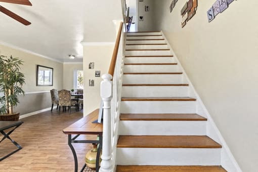 a staircase in a house with a wooden railing
