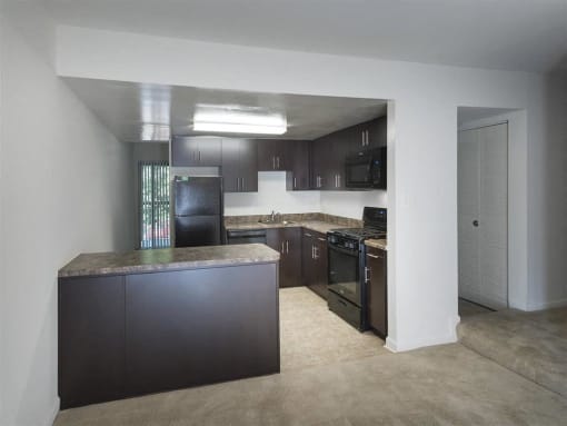Townhomes-Kitchen with an island in our townhomes  at Trillium Apartments, Fairfax, Virginia
