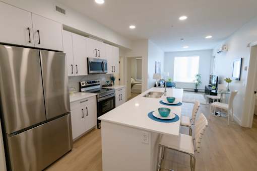Spacious Douglas Place apartment kitchen with modern cabinetry and full-size appliances