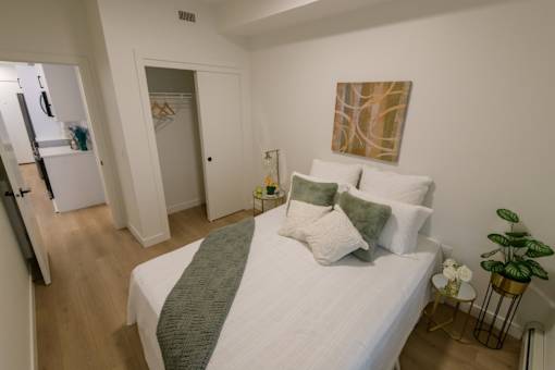 Douglas Place apartment bedroom with clean layout and modern furnishings