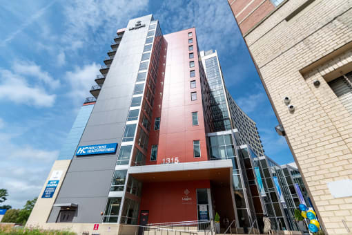 a tall building with a blue sky in the background