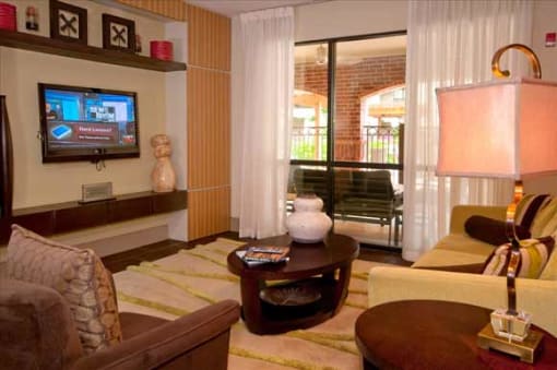 a living room filled with furniture and a wall with