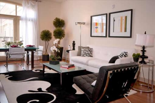 a living room with a white couch and a coffee table