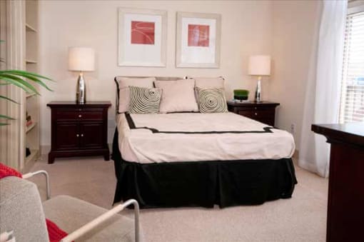 a bedroom with a bed and a chair