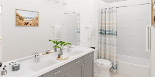 A bathroom with a white sink, toilet, and shower.