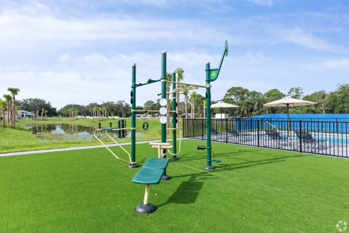 a park with a playground and a swimming pool