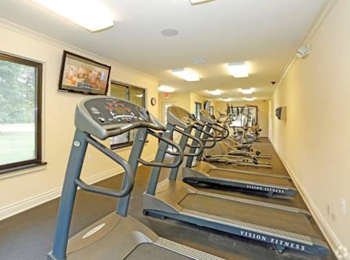 a row of cardio equipment in the gym at the resort