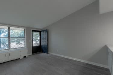 A room with a window and a door.