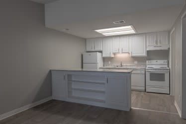 A kitchen with white appliances and cabinets.