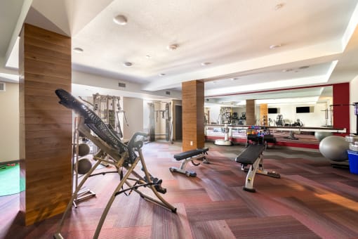 a home gym with a variety of exercise equipment