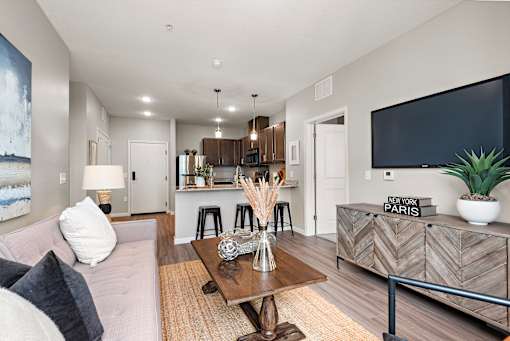 Living Room With Kitchen View at Decatur Landing I & II, Brooklyn Park Minnesota