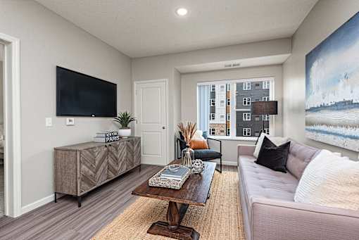 Living Room With TV at Decatur Landing I & II, Brooklyn Park