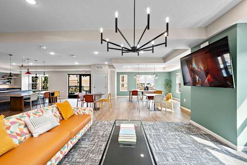 Clubroom With TV at Decatur Landing I & II, Brooklyn Park Minnesota