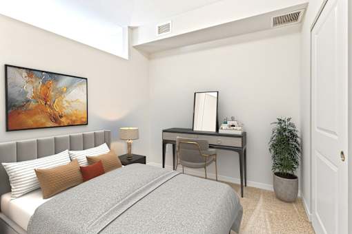 a bedroom with a bed and a desk at EastGate Apartments, Rochester, Minnesota