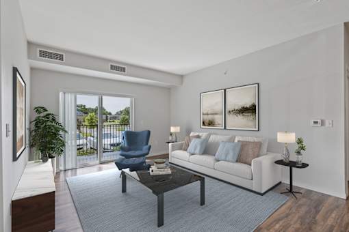 a living room with a couch and a chair and a sliding glass door at EastGate Apartments, Rochester, MN, 55904