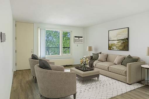 a living room with a couch and two chairs at Humboldt Senior 55+ Apartments, Saint Paul, Minnesota