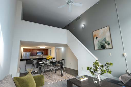a living room with a dining room table and a kitchen at Parkside Apartments, St. Paul, Minnesota