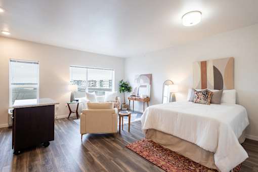 a bedroom with a bed and a desk and a chair at Technology Park Apartments, Rochester, MN, 55901