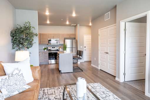 a living room and kitchen with a couch and a table at Technology Park Apartments, Rochester, Minnesota