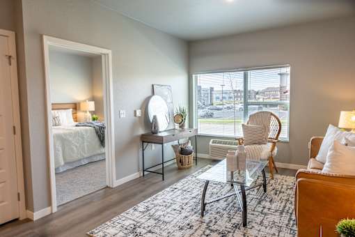 an open living room with a bedroom in the background at Technology Park Apartments, Rochester, 55901