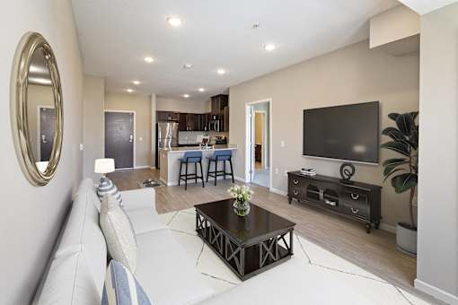 a living room with a couch and a television at The Winslow 62+ Apartments, Minnesota