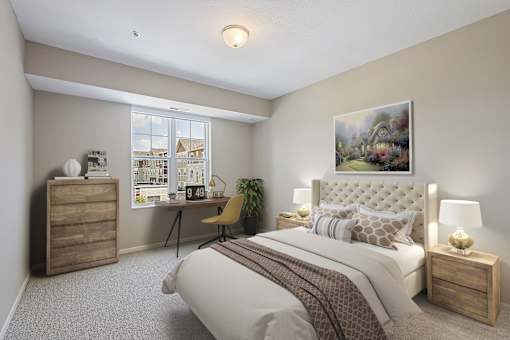 an empty bedroom with a bed and a desk at The Winslow 62+ Apartments, Minnesota, 55118