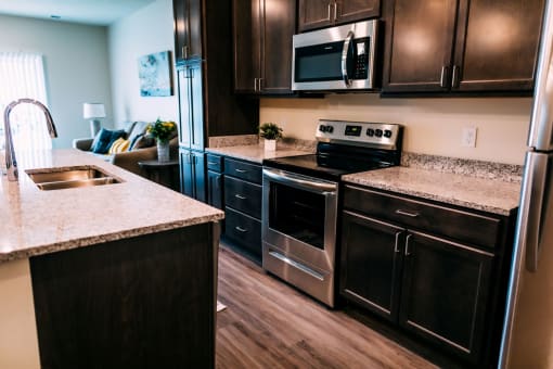 a kitchen with oven and stove