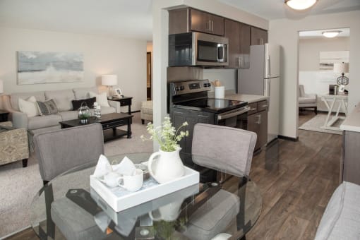 one plus den model, upgraded kitchen with slate cabinetry, vinyl flooring, dining area