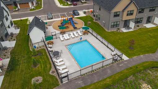 A residential area with a pool and a playground.