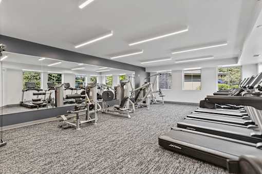 a gym with treadmills and other exercise equipment at Audenn Apartments, Minnesota