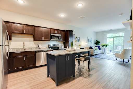 beautiful kitchen with granite and stainless steel appliances at Lake Jonathan Flats, Chaska, 55318