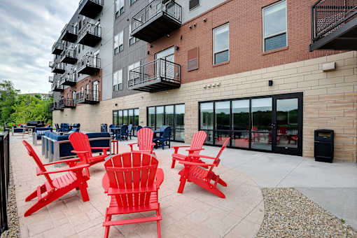 Outdoor patio with grilling and seating at Lake Jonathan Flats, Chaska