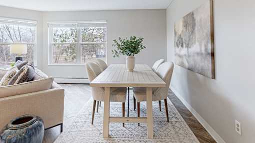 a dining room with a table and chairs at Audenn Apartments, Minnesota