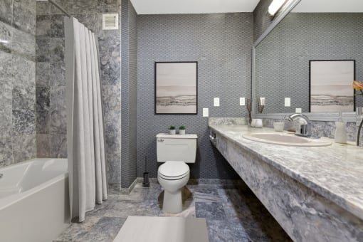 a bathroom with a toilet sink and bathtub