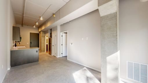 A spacious bathroom with a large mirror and a sink at Ardor on the Bluffs South Loop Residences Apartments, Minnesota, 55425