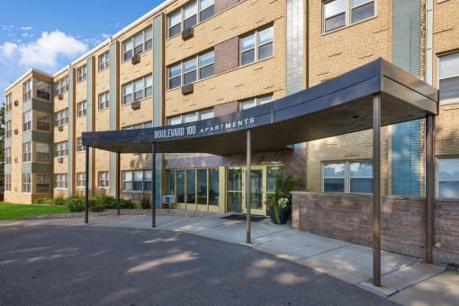a brick building with an awning and the entrance to solstice dc apartments
