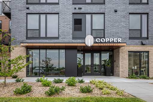 A building with a sign that says "COPPER" on it.