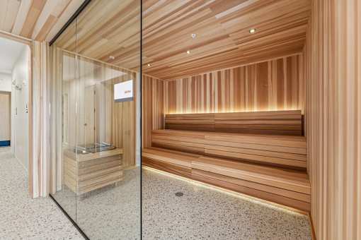 A room with wooden walls and a glass door.
