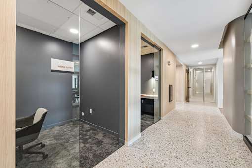 A hallway with a sign that says "Work Starts" on the wall.