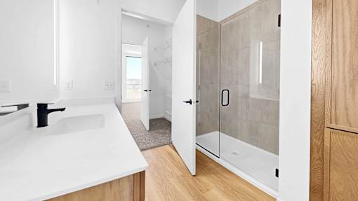 A white sink in a modern bathroom.