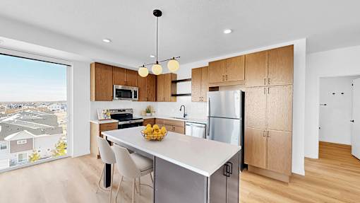 A modern kitchen with a view of the city.
