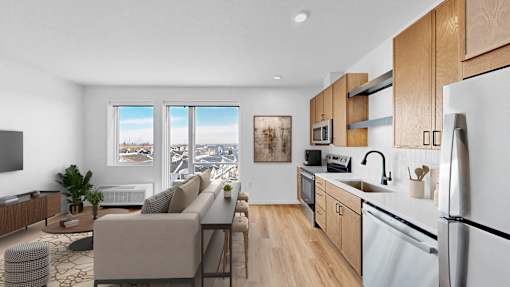 A modern kitchen with a view of the city through the windows.