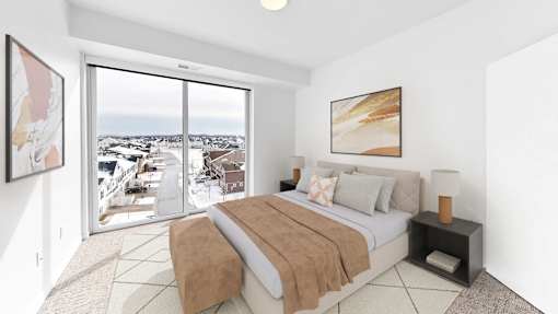 A bedroom with a large bed and a view of the outside.