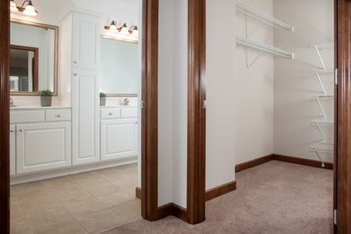 Walk-in closet with master bath and dual sink