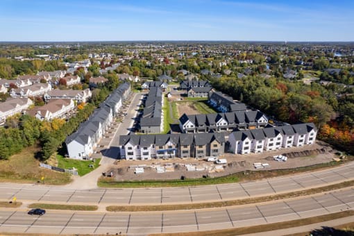 an aerial view of houses in a suburb of a city