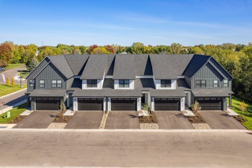 an aerial view of a house with three garage doors