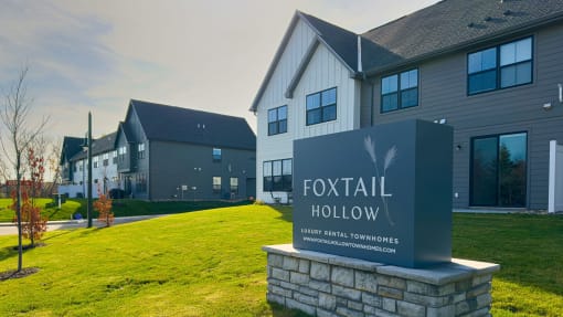 a sign for football hollow in front of a building